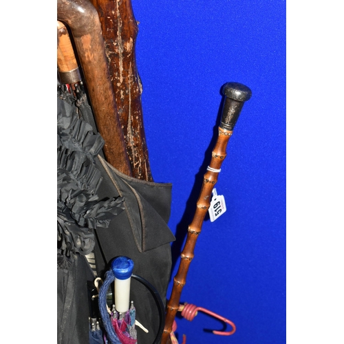 519 - A QUANTITY OF VINTAGE UMBRELLAS AND WALKING STICKS, comprising a striped 'Lawtex' silk umbrella with... 