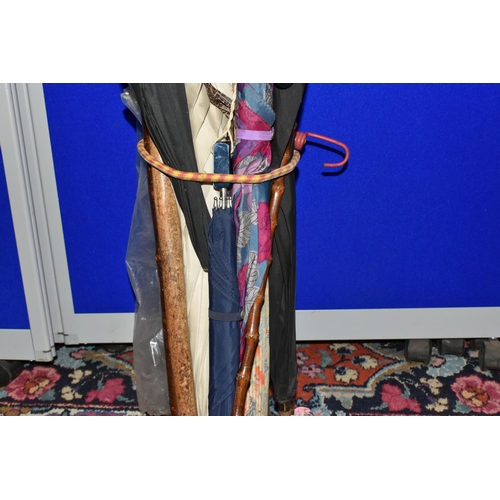 519 - A QUANTITY OF VINTAGE UMBRELLAS AND WALKING STICKS, comprising a striped 'Lawtex' silk umbrella with... 