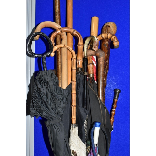 519 - A QUANTITY OF VINTAGE UMBRELLAS AND WALKING STICKS, comprising a striped 'Lawtex' silk umbrella with... 