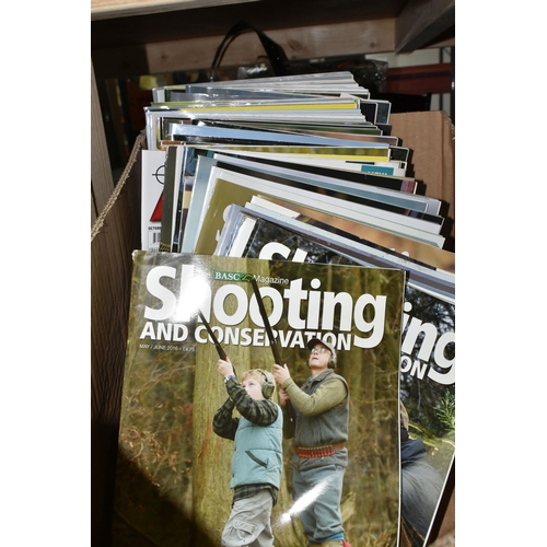 503 - FOUR BOXES AND LOOSE SHOOTING SUPPLIES to include a box of Shooting and Conservation magazines, two ... 