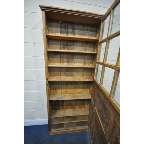 1201 - A TALL NARROW PINE PANELLED TWO DOOR CUPBOARD, enclosing five fixed shelves, over six drawers, width... 