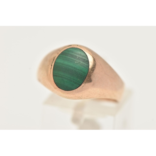 13 - A MALACHITE SIGNET RING, designed as an oval malachite cabochon to the tapered band, stamped 375, ri... 