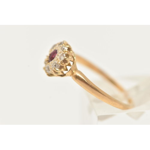 2 - A RUBY AND DIAMOND CLUSTER RING, designed as a central oval shape ruby within an old cut diamond sur... 