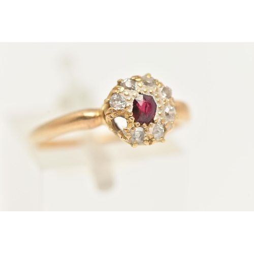 2 - A RUBY AND DIAMOND CLUSTER RING, designed as a central oval shape ruby within an old cut diamond sur... 