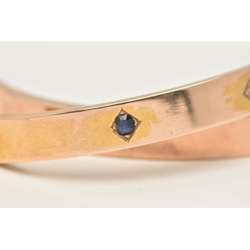 20 - A ROSE METAL BANGLE, AF broken bangle requires some attention, set with a single old cut diamond and... 