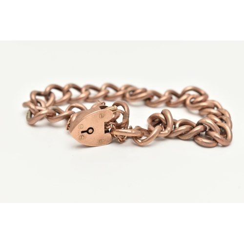 29 - A 9CT ROSE GOLD CURB LINK BRACELET, hollow links stamped 9ct, fitted with a heart padlock clasp and ... 