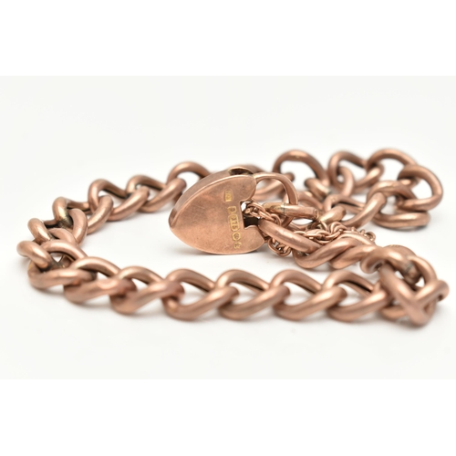 29 - A 9CT ROSE GOLD CURB LINK BRACELET, hollow links stamped 9ct, fitted with a heart padlock clasp and ... 