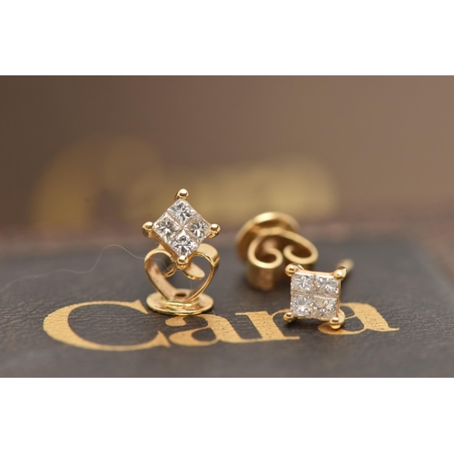 34 - A PAIR OF DIAMOND EARRINGS, yellow metal mounts, set with four princess cut diamonds in an invisible... 