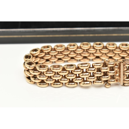 45 - A HEAVY 9CT GOLD CHAIN BRACELET, a yellow gold brick link style chain, fitted with an integrated pus... 