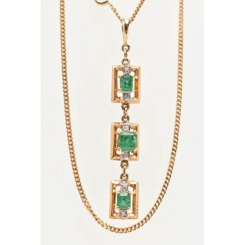 50 - A YELLOW METAL AND EMERALD NECKLACE, designed as three rectangular open work panels, two set with an... 