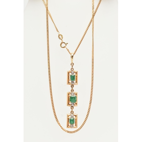 50 - A YELLOW METAL AND EMERALD NECKLACE, designed as three rectangular open work panels, two set with an... 