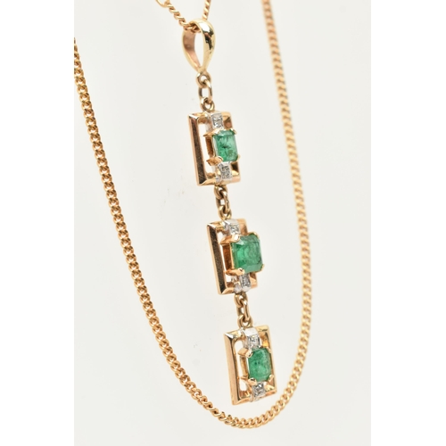 50 - A YELLOW METAL AND EMERALD NECKLACE, designed as three rectangular open work panels, two set with an... 