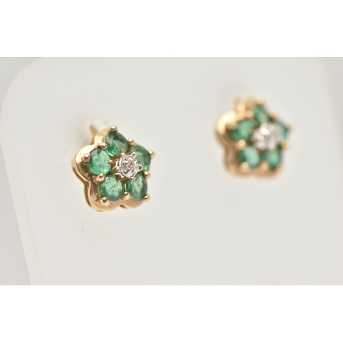 51 - A PAIR OF GEM SET EARRINGS, designed as a yellow metal flower, each prong set with five circular cut... 