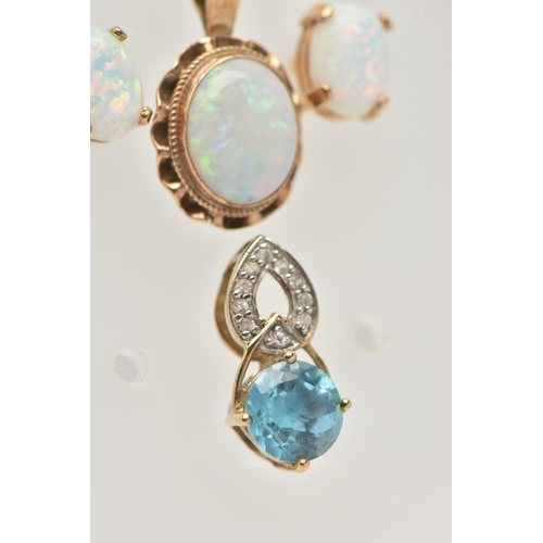 56 - A SMALL ASSORTMENT OF JEWELLERY, to include a yellow metal and opal pendant, unmarked, a blue topaz ... 