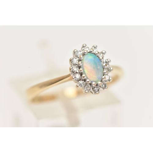 58 - A 9CT GOLD OPAL AND DIAMOND CLUSTER, an oval opal, prong set with a surround of round brilliant cut ... 