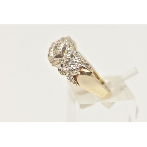 6 - A 9CT GOLD DIAMOND RING, a band ring with cross over detail, grain set with single cut diamonds, app... 