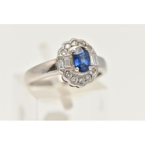 60 - A WHITE METAL GEM SET RING, a principally set oval cut blue sapphire, set with a surround of ten rou... 