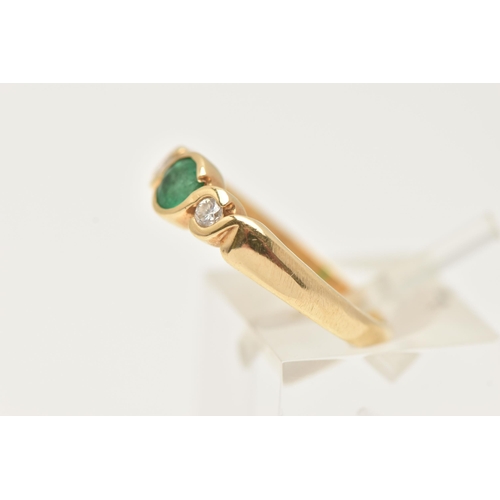 64 - AN 18CT GOLD EMERALD AND DIAMOND RING, a principally set circular cut emerald in a yellow gold twist... 