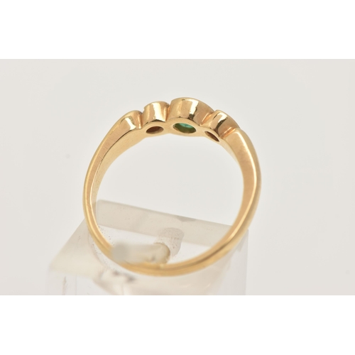 64 - AN 18CT GOLD EMERALD AND DIAMOND RING, a principally set circular cut emerald in a yellow gold twist... 