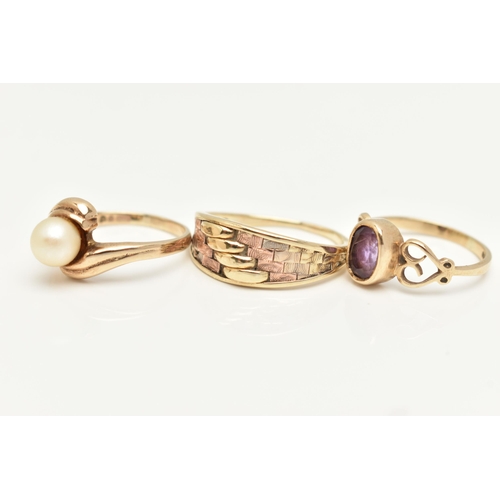 73 - THREE 9CT GOLD RINGS, the first set with an oval cut amethyst, open work heart detailed shoulders, h... 