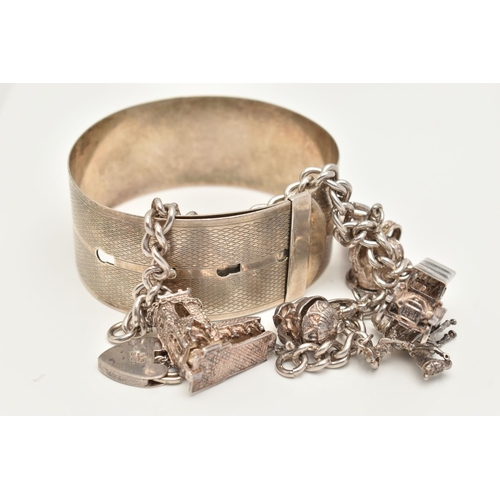 81 - A WHITE METAL CHARM BRACELET AND BANGLE, the charm bracelet suspending eight charms from a curb link... 