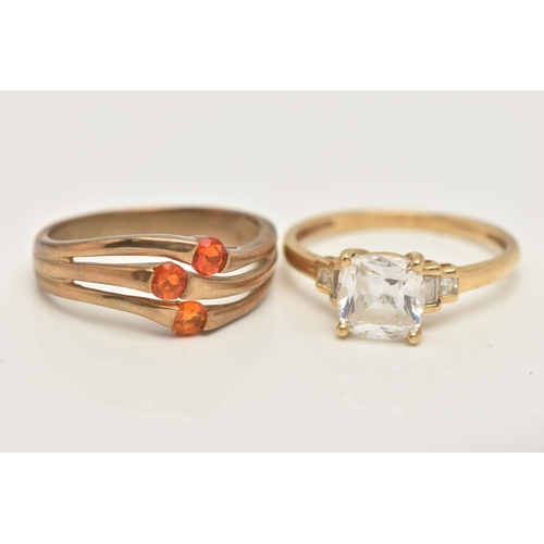 112 - TWO GOLD GEM SET RINGS, the first a 14ct gold colourless paste dress ring, the second a 9ct gold ora... 