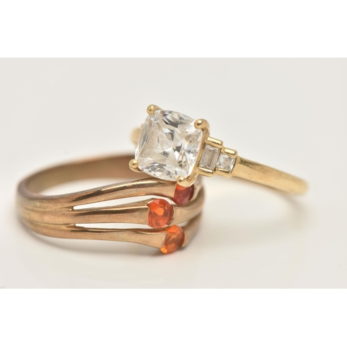 112 - TWO GOLD GEM SET RINGS, the first a 14ct gold colourless paste dress ring, the second a 9ct gold ora... 