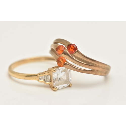 112 - TWO GOLD GEM SET RINGS, the first a 14ct gold colourless paste dress ring, the second a 9ct gold ora... 