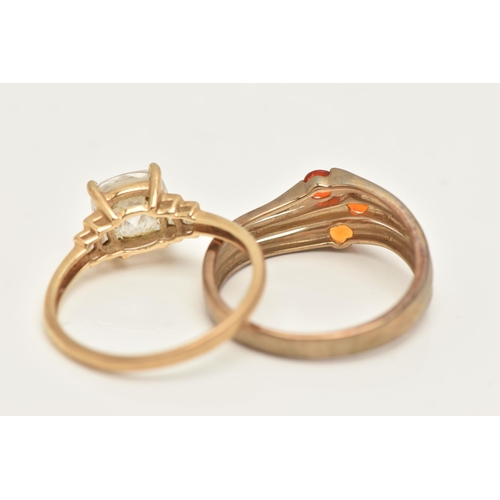 112 - TWO GOLD GEM SET RINGS, the first a 14ct gold colourless paste dress ring, the second a 9ct gold ora... 