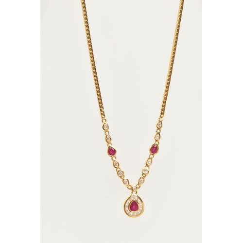 121 - AN 18CT YELLOW GOLD RUBY AND DIAMOND NECKLACE, the pendant fitted with a pear cut dropper set with a... 