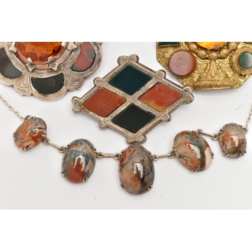123 - FOUR ITEMS OF JEWELLERY, to include a Scottish white metal hardstone and orange paste set brooch, fi... 