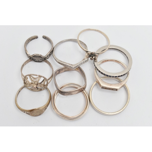 132 - TEN WHITE METAL RINGS, of various designs and sizes, some stamped 925, silver, some unmarked metal (... 