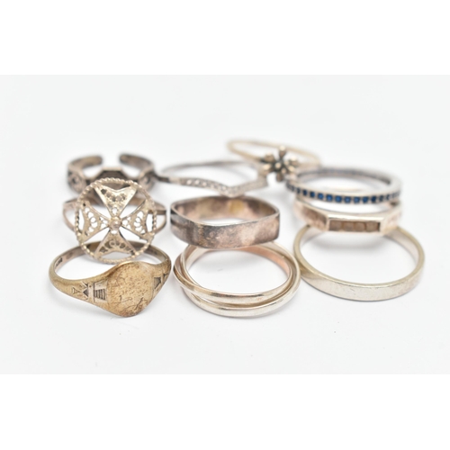 132 - TEN WHITE METAL RINGS, of various designs and sizes, some stamped 925, silver, some unmarked metal (... 
