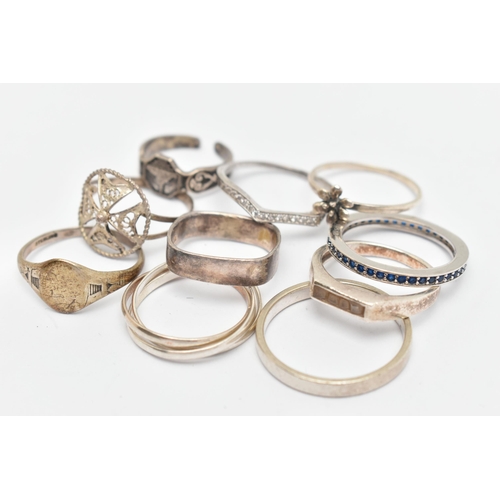 132 - TEN WHITE METAL RINGS, of various designs and sizes, some stamped 925, silver, some unmarked metal (... 