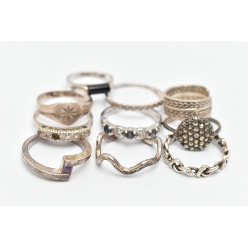 133 - TEN WHITE METAL RINGS, of various designs and sizes, some stamped 925, silver, some unmarked metal, ... 