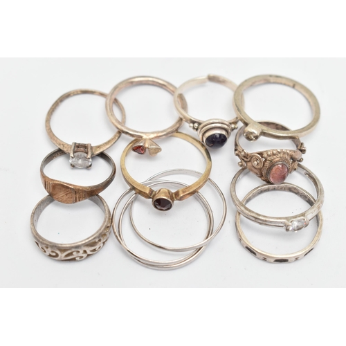 135 - ELEVEN WHITE METAL RINGS, of various designs and sizes, some stamped 925, silver, some unmarked meta... 