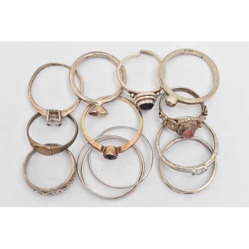 135 - ELEVEN WHITE METAL RINGS, of various designs and sizes, some stamped 925, silver, some unmarked meta... 