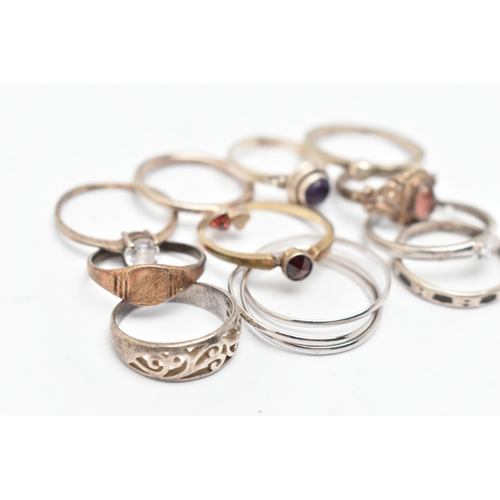 135 - ELEVEN WHITE METAL RINGS, of various designs and sizes, some stamped 925, silver, some unmarked meta... 
