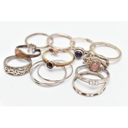 135 - ELEVEN WHITE METAL RINGS, of various designs and sizes, some stamped 925, silver, some unmarked meta... 