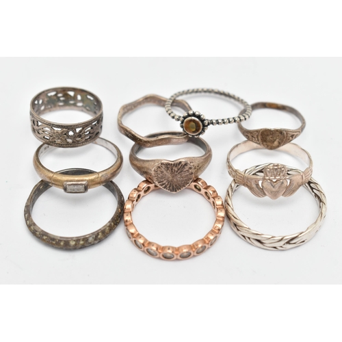 136 - TEN WHITE METAL RINGS, of various designs and sizes, some stamped 925, silver, some unmarked metal, ... 