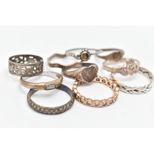 136 - TEN WHITE METAL RINGS, of various designs and sizes, some stamped 925, silver, some unmarked metal, ... 