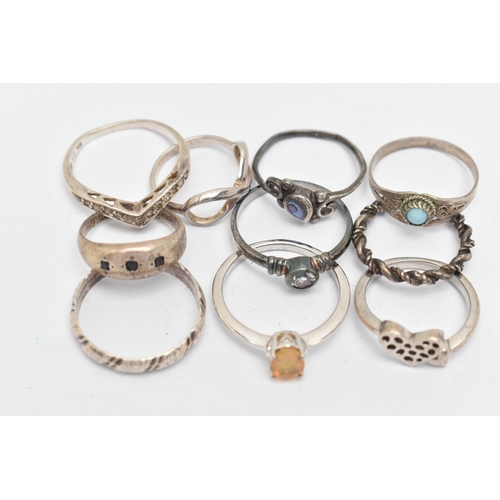 137 - TEN WHITE METAL RINGS, of various designs and sizes, some stamped 925, silver, some unmarked metal, ... 