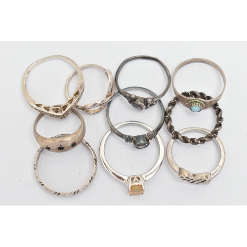 137 - TEN WHITE METAL RINGS, of various designs and sizes, some stamped 925, silver, some unmarked metal, ... 