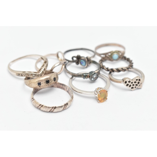 137 - TEN WHITE METAL RINGS, of various designs and sizes, some stamped 925, silver, some unmarked metal, ... 
