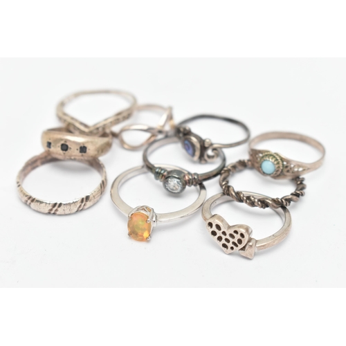 137 - TEN WHITE METAL RINGS, of various designs and sizes, some stamped 925, silver, some unmarked metal, ... 
