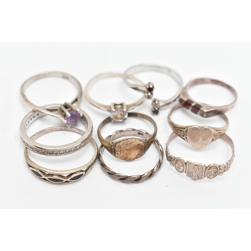 138 - TEN WHITE METAL RINGS, of various designs and sizes, some stamped 925, silver, some unmarked metal (... 