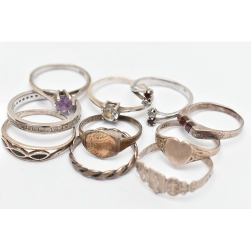 138 - TEN WHITE METAL RINGS, of various designs and sizes, some stamped 925, silver, some unmarked metal (... 