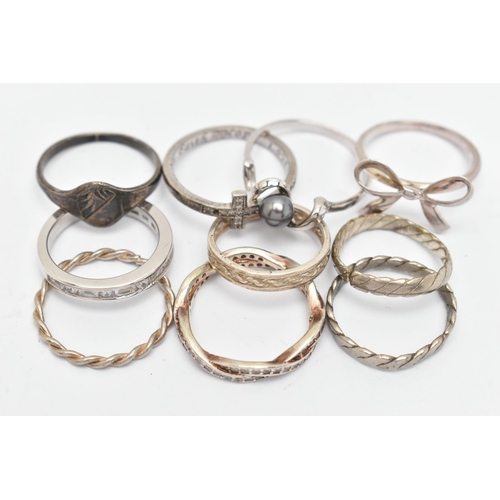 140 - TEN WHITE METAL RINGS, of various designs and sizes, some stamped 925, silver, some unmarked metal (... 