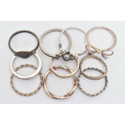 140 - TEN WHITE METAL RINGS, of various designs and sizes, some stamped 925, silver, some unmarked metal (... 