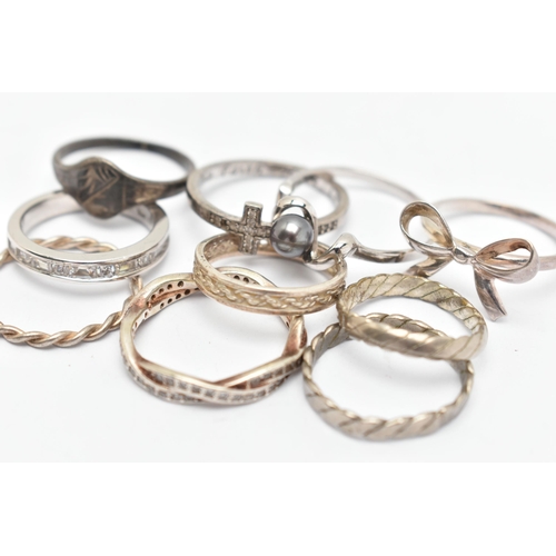 140 - TEN WHITE METAL RINGS, of various designs and sizes, some stamped 925, silver, some unmarked metal (... 
